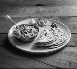 Sev tamatar with roti