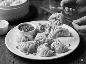 Veg cheese momos steam