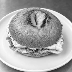 Toasted Bagel Layered With Fluffy Eggs, Savoury Salami, Crisp Lettuce, Fresh Tomato And Onion.