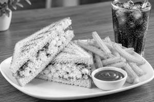 Classic egg sandwich with fries and cold drink