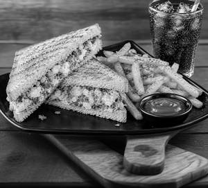 Masala egg sandwich with fries and cold drink