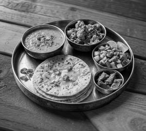 Dal + 4 Roti+ 1 Sabji Of The Day + Salad + Aachaar