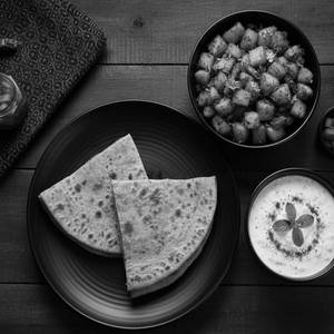 Jeera Aloo, 2 Tikona Parathas And Boondi Raita Combo