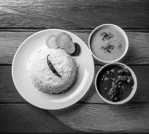 Rice Dal And Chicken Masala Curry Thali