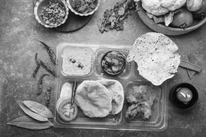 Luchi With Cholar Dal And Chicken Kasha