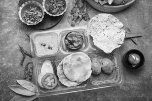 Luchi With Cholar Dal And Egg Curry