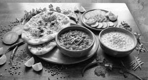 Chole + 2 Aloo Naan + Raita + Salad