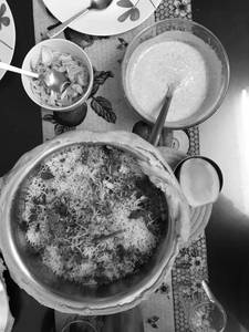 Handi chicken egg dum biryani with raita and gravy