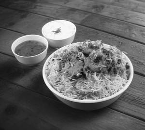 Chicken Dum biryani half and chicken half