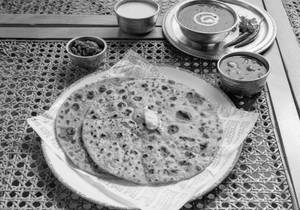 Cheese Garlic Paratha With Dal Makhani