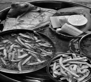 Sev Bhaji ( Doodh ) With 2 Nos. Tawa Butter Roti With Butter Milk & Small Nos.Jaggery.
