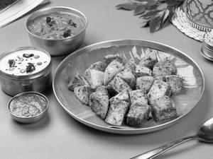 Millet Ghee Curryleaf Podi Tossed Idli