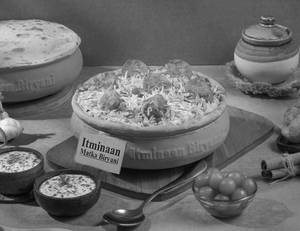 1 KG Dum Aloo Matka Biryani + FREE Dessert