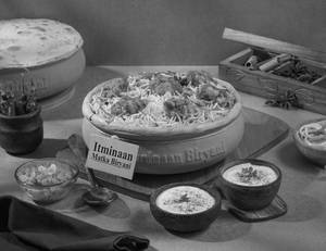 1 KG Bhuna Chicken Matka Biryani + FREE Dessert