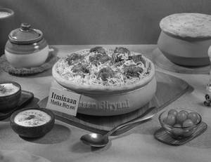 1 KG Chicken Tikka Matka Biryani + FREE Dessert