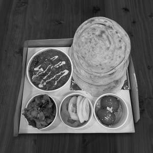 Kodi Egru (Chicken Curry) With Malabar Paratha (5 Items)