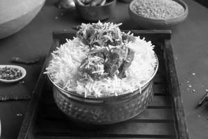 Lucknowi Gosht Biryani (2 Pcs)