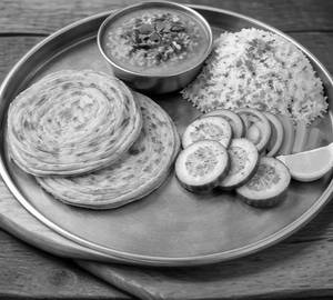 2 lachha paratha and  dal tadka and  rice+ salad