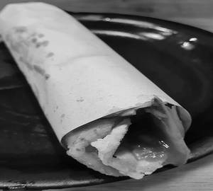 Egg roll,The Lachha Paratha (Base): A layered flatbread made from all-purpose flour (maida) or whole