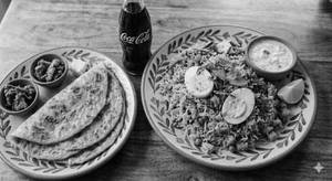 Butter mughlai pulav half with butter omlet paratha full with Coke 250ml