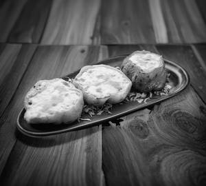 Baked Capsicum Stuffed With Mushroom