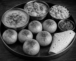 Dal Tadka + 6 Bati + Gatta + Churma + Papad + Garlic Sauce
