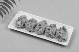 Chicken Pan Fried Momo in Butter Masala