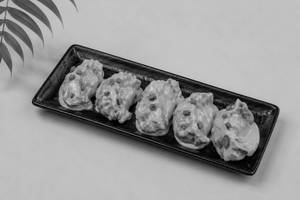 Veg Pan Fried Momo in Butter Masala