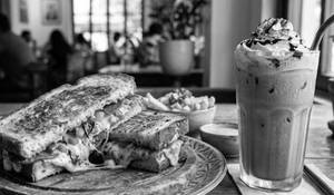 Cheesy burst pizza sandwich with cold coffee