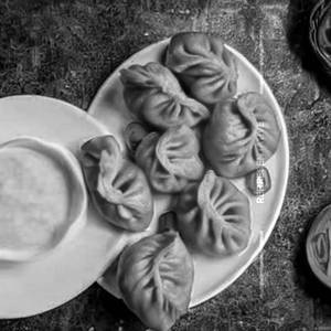 Cheesy Corn Momos Schezwan Tossed