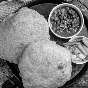 2 Chole Bhature + 2 Vada Pav