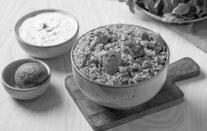 Kodi Pulusu Annam Served With Fried Egg & Raitha