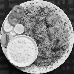 Biryani With Mirchi Salad & Raita
