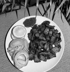 Smoked Pork Dry Fry W/ Mejenga Seeds