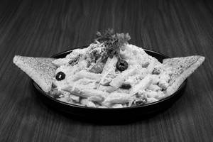 Penne Pasta In Alfredo Sauce Served With Butter Bread