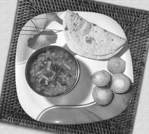 Sev tamatar with butter tawa roti
