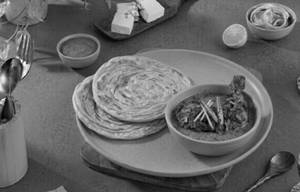 Tawa Chicken [1 Piece] + 2 Lachha Paratha + Chutney + Onion