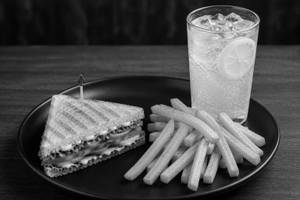Veg sandwich with fries and lemon fizz