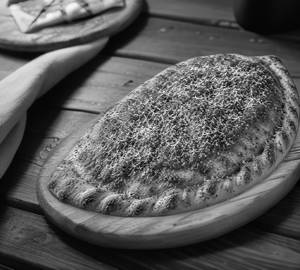 Three cheese Caprese calzone