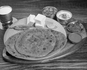 Tawa Paneer Paratha With Chole,Pickel & Raita