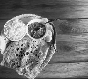 2 Pcs Parotha, Half Rice, Sabji