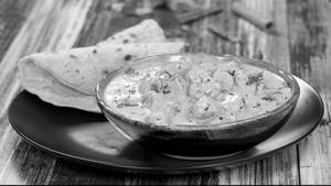 Rajasthani Gatta Curry & Choice Of Roti Combo