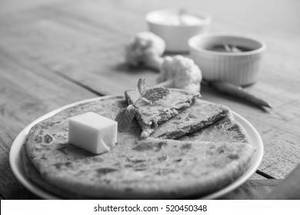 Aloo Paratha butter with curd