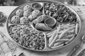 Chilli Paneer, Fried Rice, French Fries, Spring Roll and Veg Momos Platter