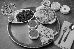 Veg Biryani + Manchurian+3 Pulka Curry