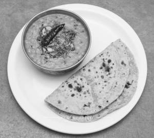 Dal Tadka + Tawa Plain Roti (2 Pieces)