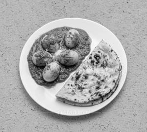 Egg Cuury ( Best Seller ) + Butter Tandoori Roti (1 piece)