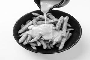 French Fries In Molten Cheese Sauce