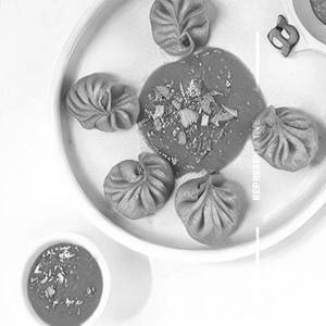 Paneer  Achari Gravy Momos