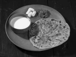 Paneer Paratha With Curd        